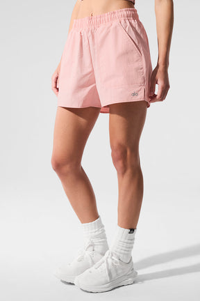 Alumni Short in soft pink, featuring high-waist design, internal drawcord, and side pockets for essentials.