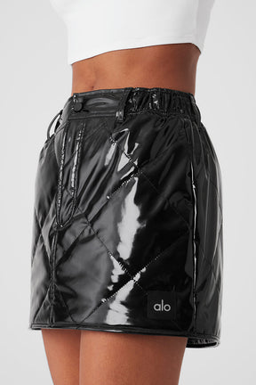 Snomoto puffer mini skirt in high-shine fabric with quilted finish, mid-thigh length and high-rise waistband.