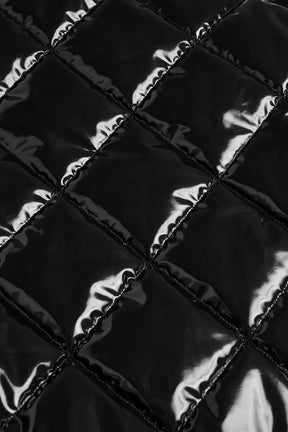 Quilted high-shine fabric texture of Snomoto Puffer Mini Skirt showcasing its stylish design and warmth.