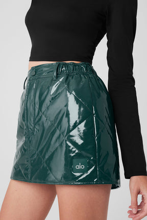 Snomoto puffer mini skirt in high-shine fabric, quilted finish with belt loops, mid-thigh length and high-rise waistband.