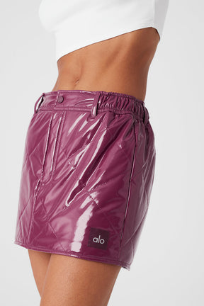 Snomoto Puffer Mini Skirt in high-shine quilted fabric, featuring a high-rise waistband and mid-thigh length.
