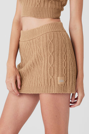 Cable Knit Winter Bliss Mini Skirt in soft beige fabric with an elastic waistband, styled for a cozy winter look.