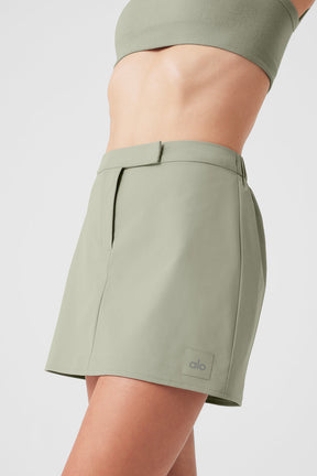 High Speed Mini Skirt in soft green with tailored fit and elastic waist for a polished look