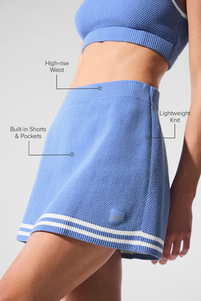 Tennis Club Sweater Knit Skirt featuring high-rise waist, A-line fit, stretchy built-in shorts, and lightweight knit design.