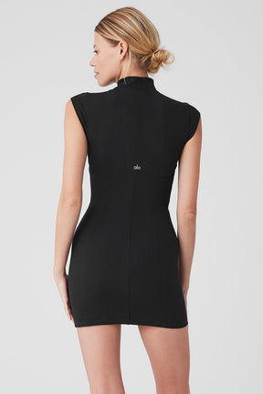 Back view of the Run It Back Dress featuring a mock neck and sleeveless design in a ribbed finish for a flattering look.