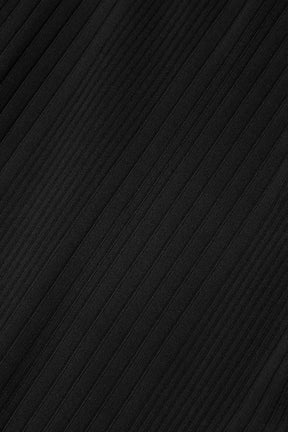 Close-up of subtly ribbed black fabric, perfect for a flattering and comfortable dress with a vintage vibe.