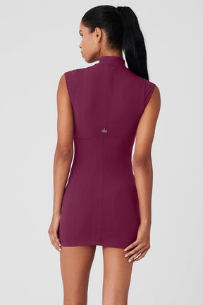 Back view of a sleeveless mock neck Run It Back Dress in ribbed burgundy fabric, highlighting its flattering silhouette.