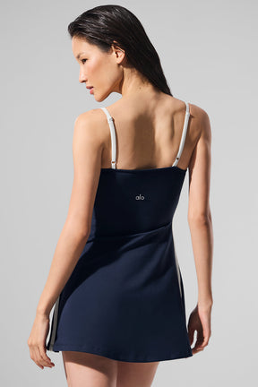Navy Airbrush Streamlined Dress showcasing a sleek A-line fit with slender straps and built-in shorts for comfort.