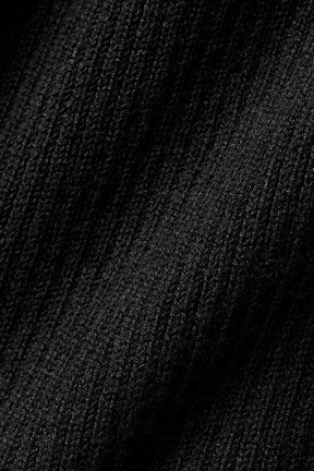 Close-up of the black fabric texture of the Supernatural Sweater Dress, showcasing its lightweight knit.