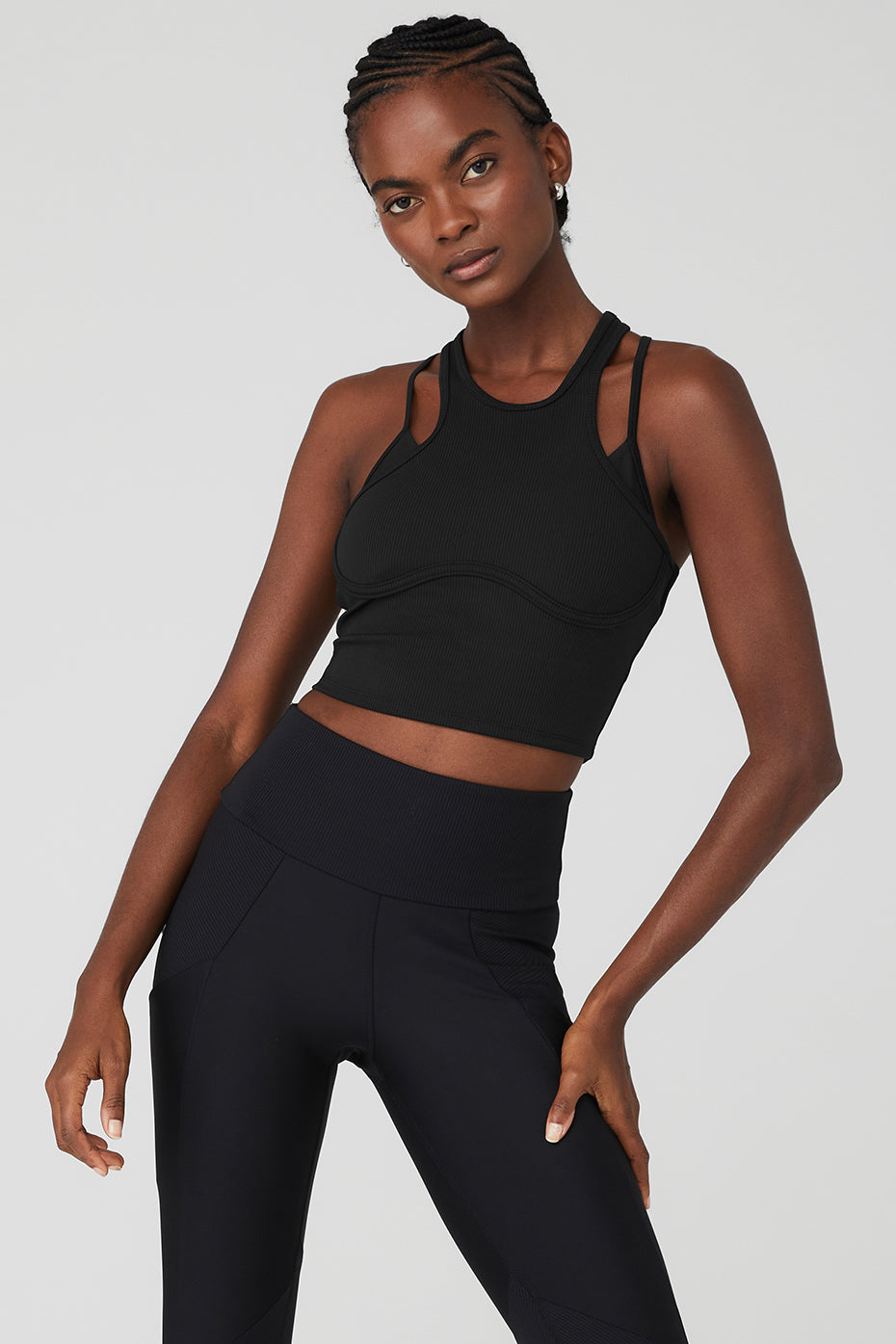Model wearing the Ribbed Airlift Enchanted Bra Tank, showcasing adjustable straps and a stylish design.