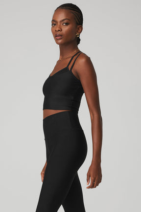 Airlift Double Check Bra Tank in black, fitted cropped style with mesh details and racerback design, paired with high-waist leggings.