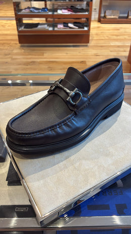 Ferragamo Gancini dark brown leather loafer featuring a signature