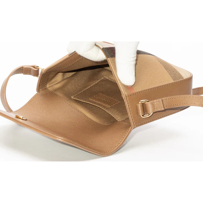 Interior view of Burberry Hampshire check canvas leather crossbody bag showcasing smooth brown leather and structured design.