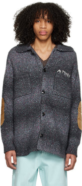AMIRI black space dye rib knit cardigan featuring suede elbow patches and logo stitched at chest, made in Italy.