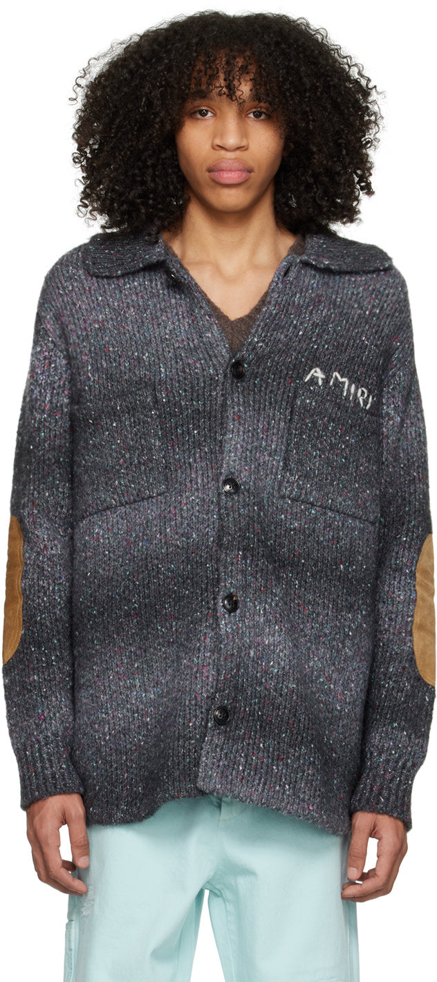 AMIRI black space dye rib knit cardigan featuring suede elbow patches and logo stitched at chest, made in Italy.