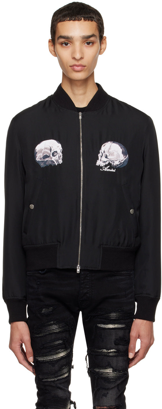 AMIRI Black Wes Lang Edition Dual Skull Bomber featuring graphic appliqués and zip closure, made of silk twill.