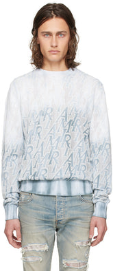AMIRI blue repeat sweater featuring hand-dyed gradient and jacquard logo pattern, made of cotton and polyester.