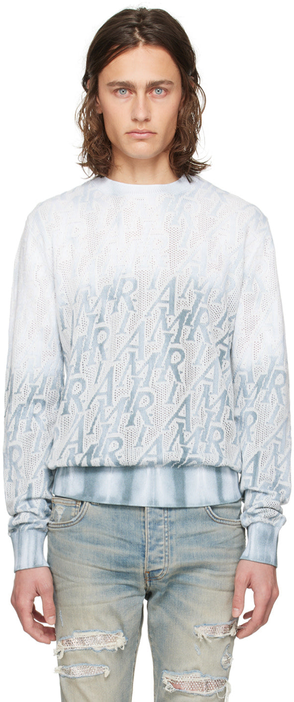 AMIRI blue repeat sweater featuring hand-dyed gradient and jacquard logo pattern, made of cotton and polyester.
