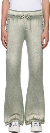 AMIRI khaki spray painted lounge pants in knit cotton and merino wool-blend with drawstring waistband and contrast stitching.