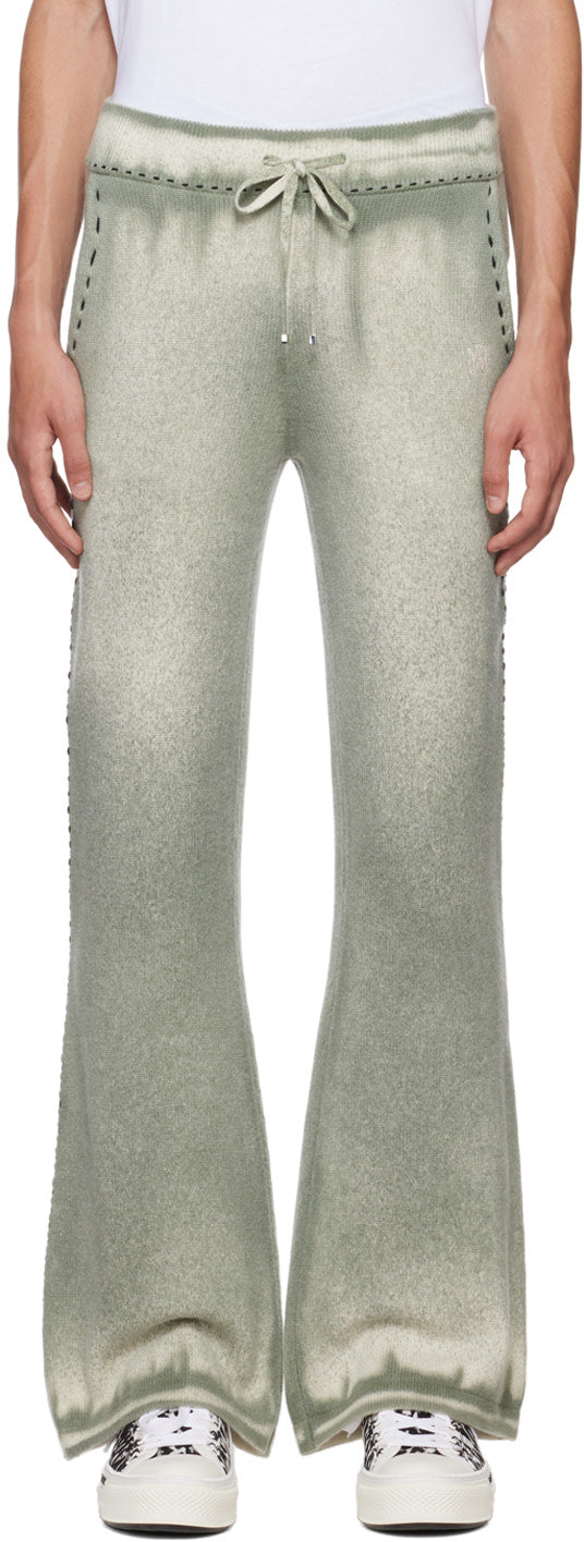 AMIRI khaki spray painted lounge pants in knit cotton and merino wool-blend with drawstring waistband and contrast stitching.