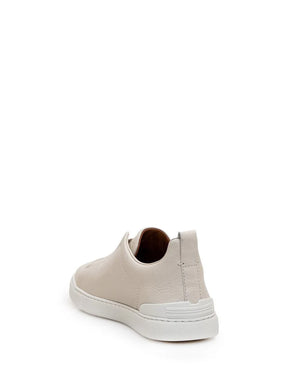 Zegna Men’s Cream Grained Leather Slip-On Sneakers – White Sole, Minimal Design