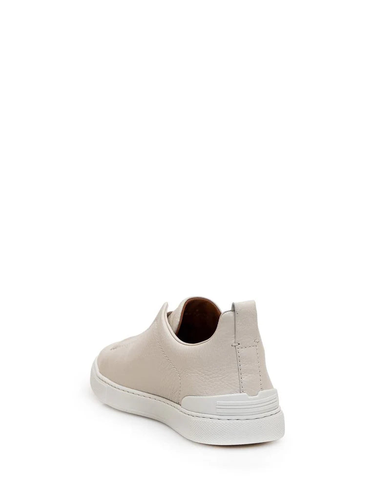 Zegna Men’s Cream Grained Leather Slip-On Sneakers – White Sole, Minimal Design
