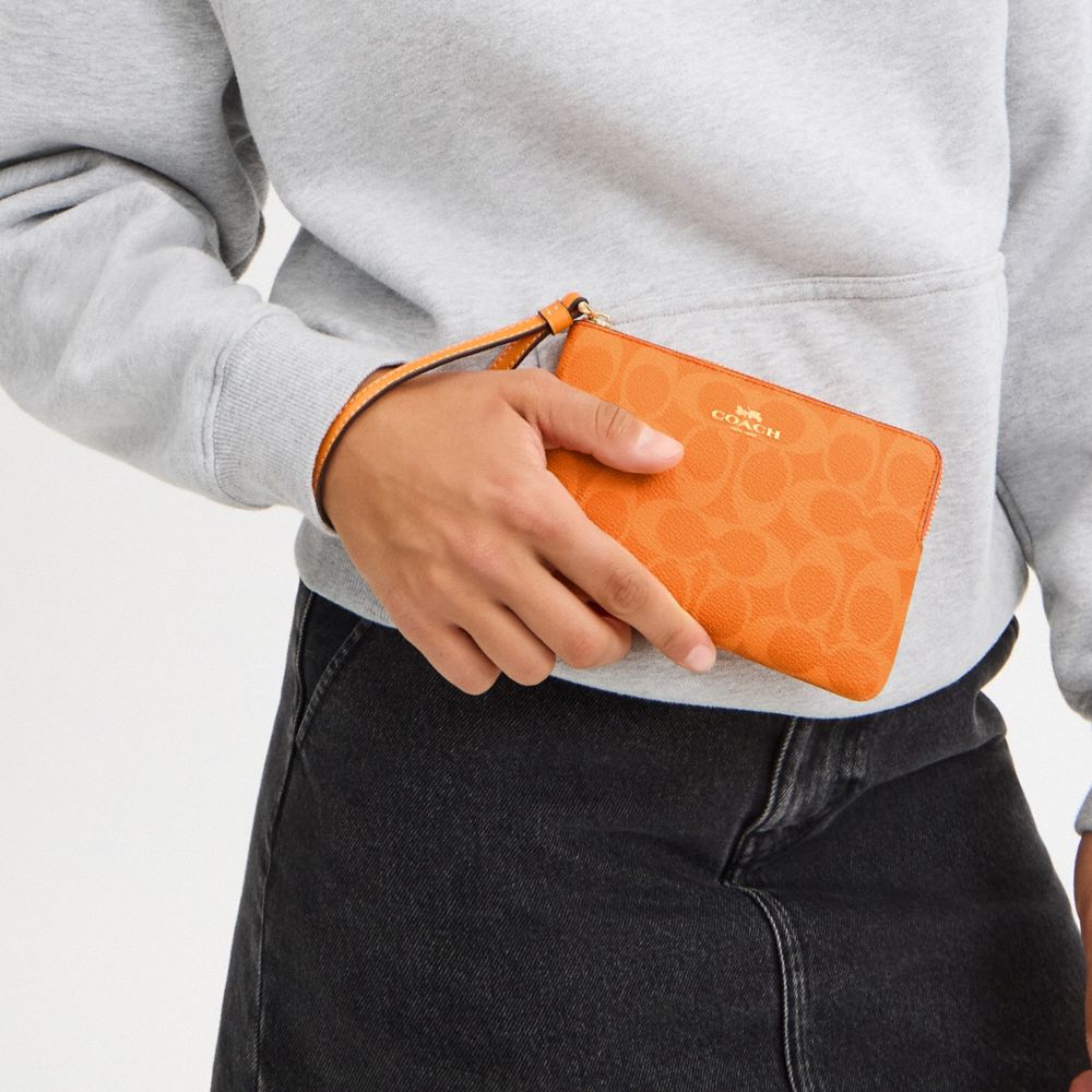 Corner Zip Wristlet In Signature Canvas