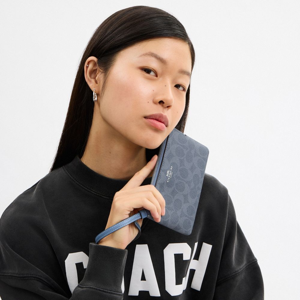 Corner Zip Wristlet In Signature Canvas