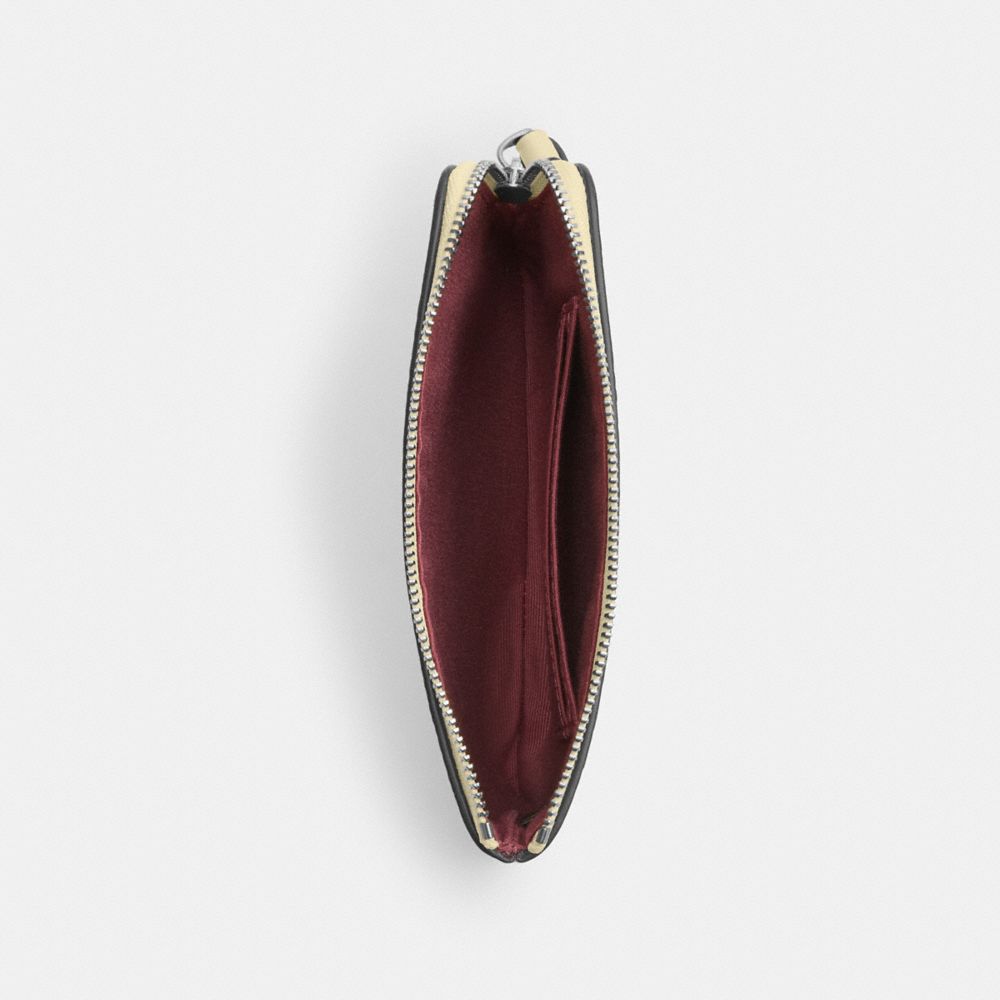 Corner Zip Wristlet In Signature Canvas