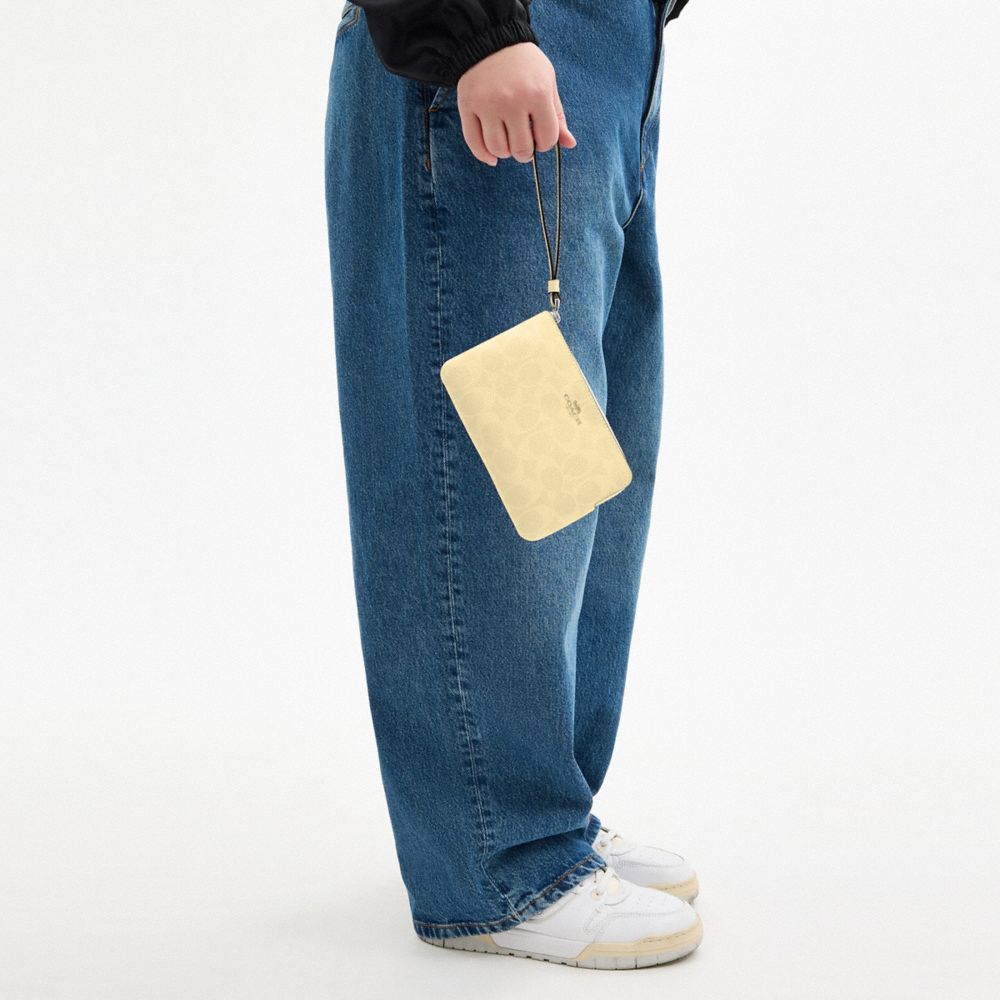 Corner Zip Wristlet In Signature Canvas