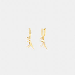 Skeletal Rexy Huggie Earrings