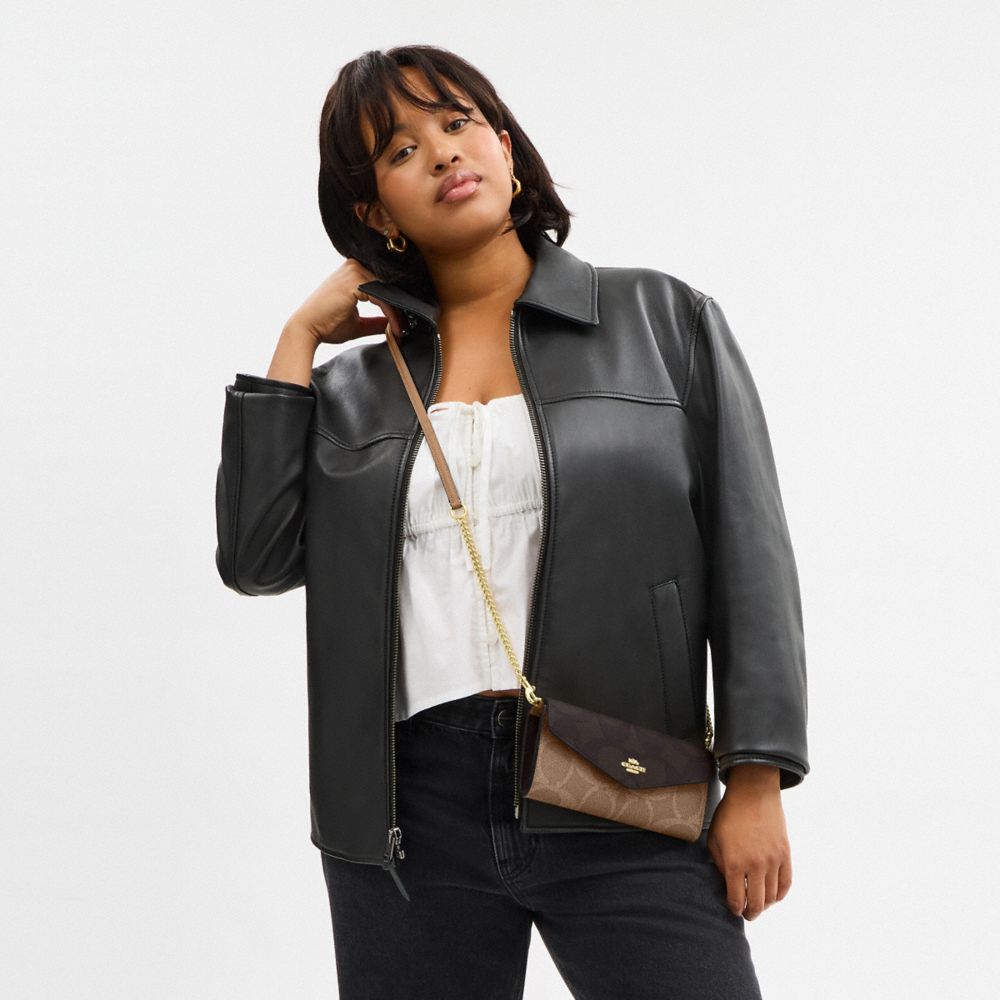 Klare Envelope Crossbody Bag In Blocked Signature Canvas