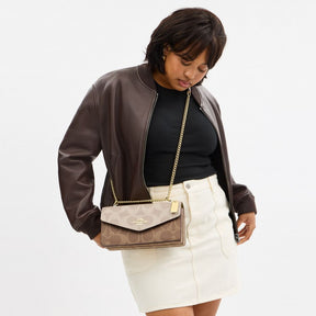 Klare Envelope Crossbody Bag In Blocked Signature Canvas