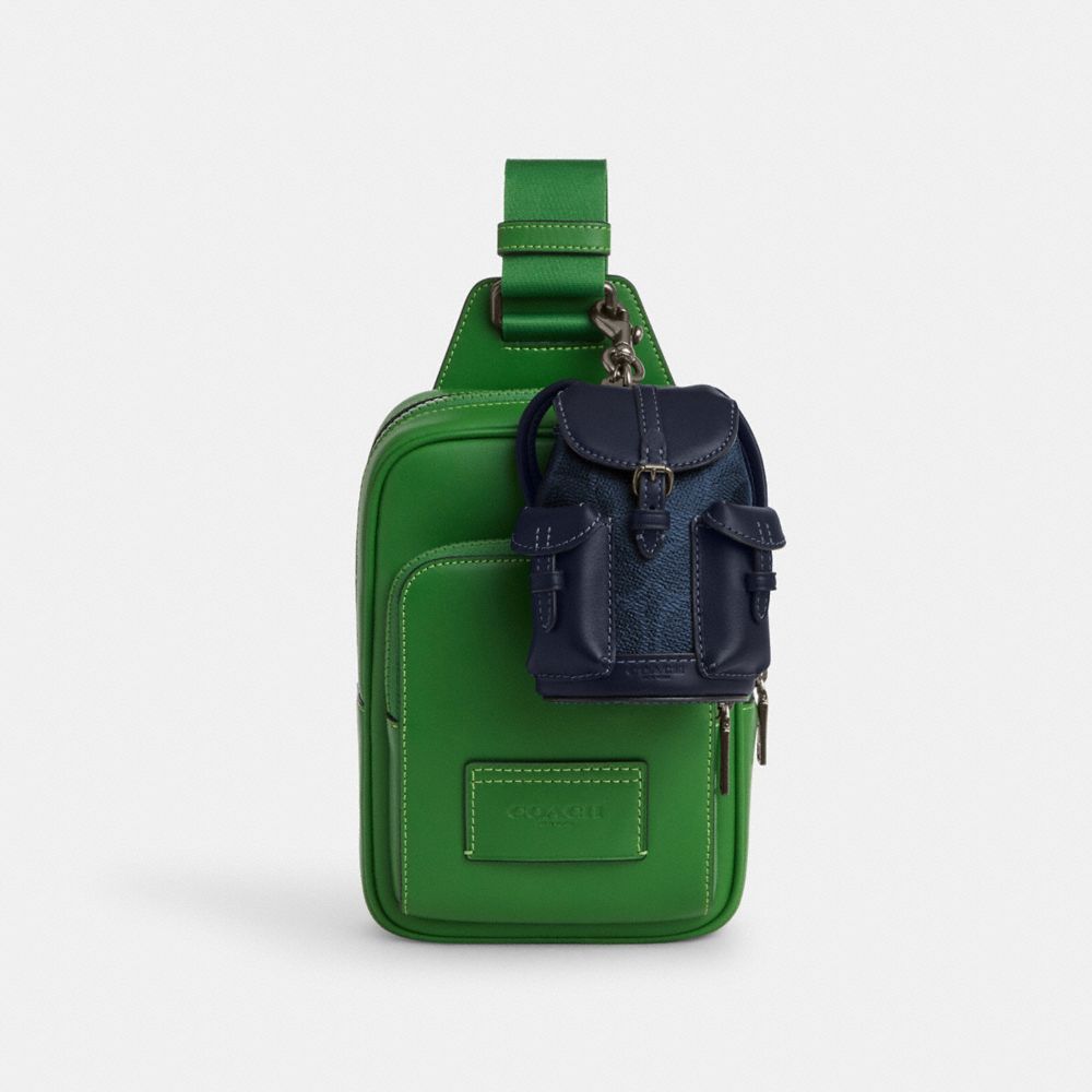 Mini Warner Backpack Bag Charm In Signature Canvas