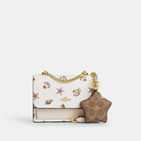 Mini Rowan Bag Charm In Signature Canvas