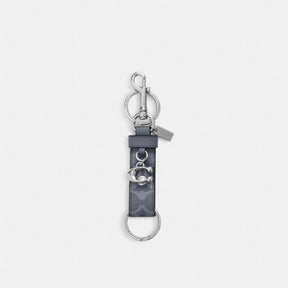 Trigger Snap Bag Charm In Signature Canvas With Charm