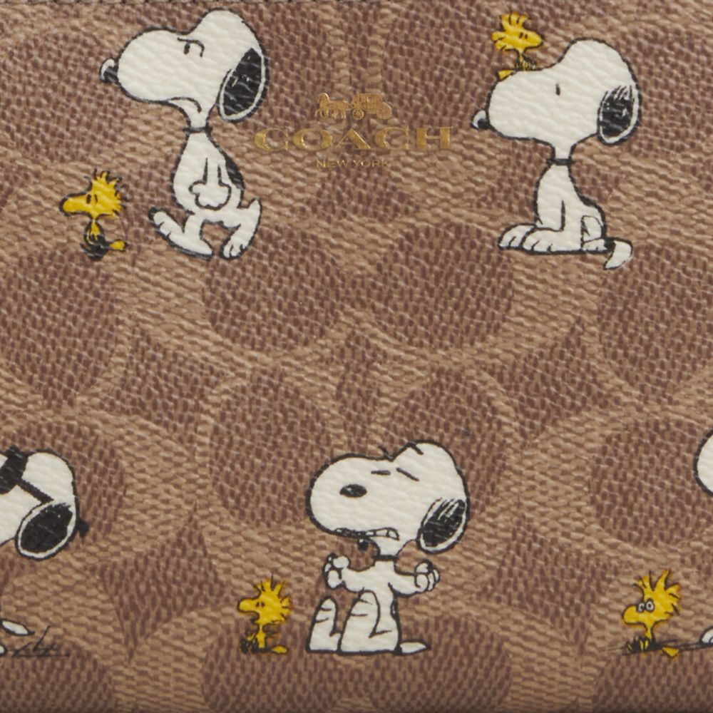 Coach X Peanuts Corner Zip Wristlet In Signature Canvas With Snoopy Print