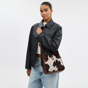 Hadley Convertible Crossbody Bag With Cow Print And Tassel