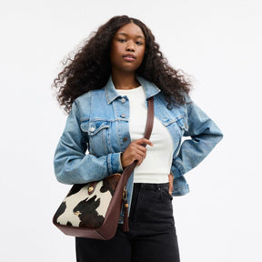 Hadley Convertible Crossbody Bag With Cow Print And Tassel