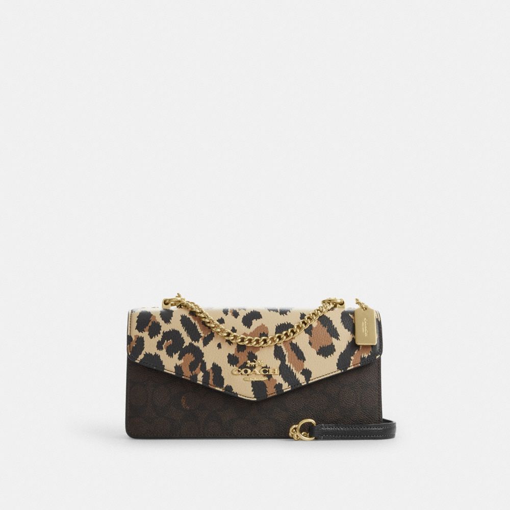 Klare Envelope Crossbody Bag In Signature Canvas With Leopard Print