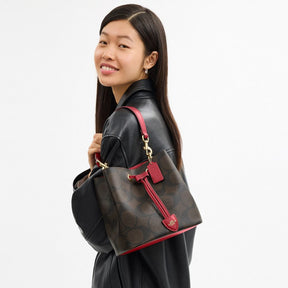 Rowan Bucket Bag In Maxi Signature Canvas