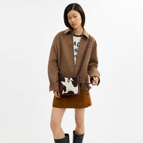 Hadley Mini Crossbody Bag With Cow Print And Tassel