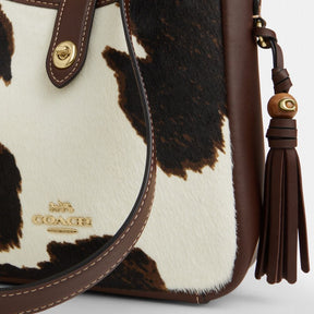 Hadley Mini Crossbody Bag With Cow Print And Tassel