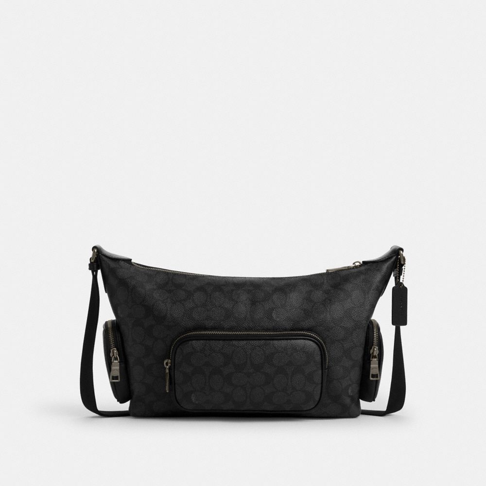 Finn Crossbody Bag With Pockets In Signature Canvas