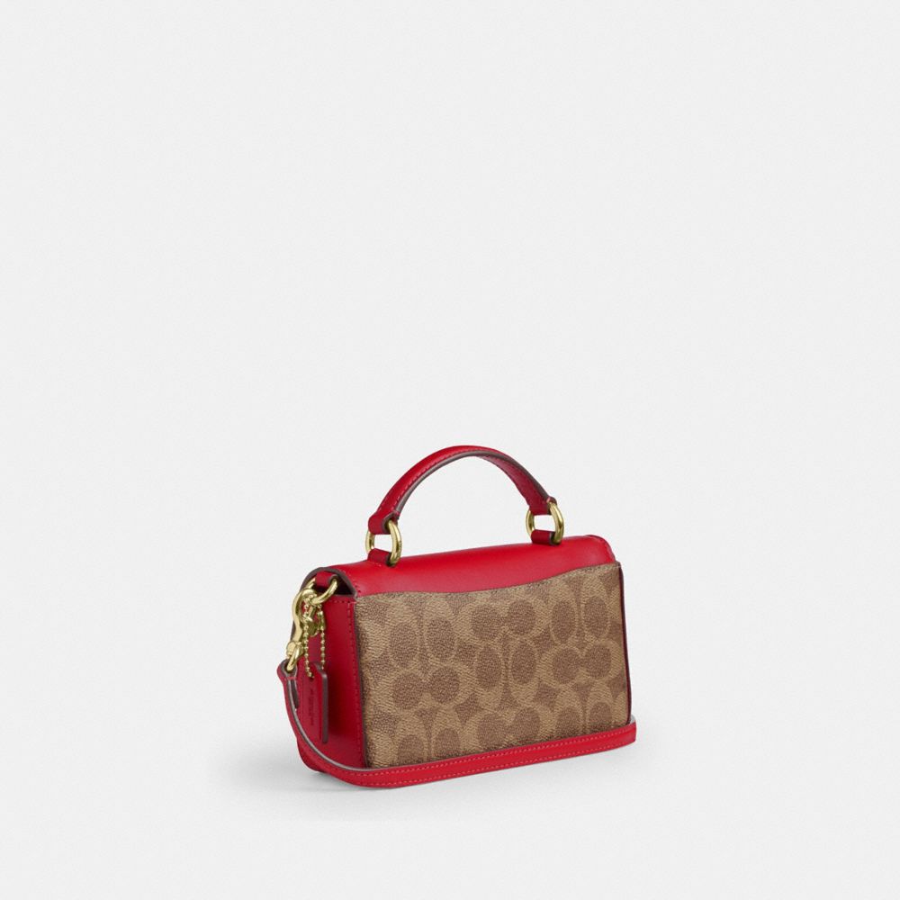 Mini Josie Top Handle Bag In Signature Canvas