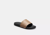 Udele Sport Slide In Signature Canvas slide sandal in coated canvas with classic C pattern and rubber sole.