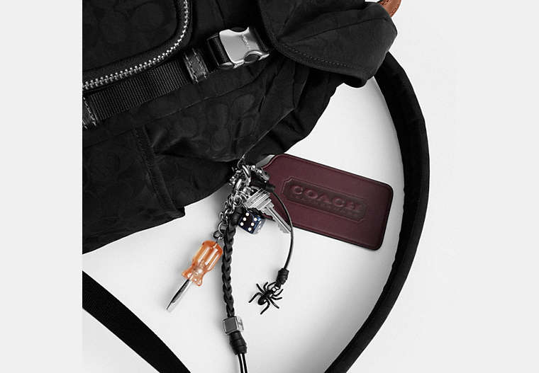 Logan Backpack In Signature Nylon With Charms