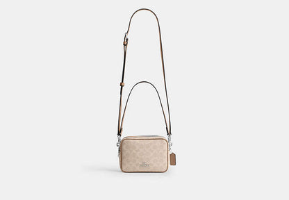 Mini Carey Crossbody Bag In Signature Canvas
