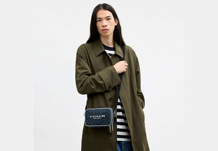 Colton Crossbody Bag 19 In Signature Canvas With Coach Graphic