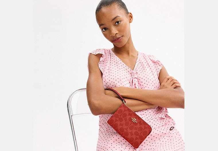 Corner Zip Wristlet In Signature Canvas